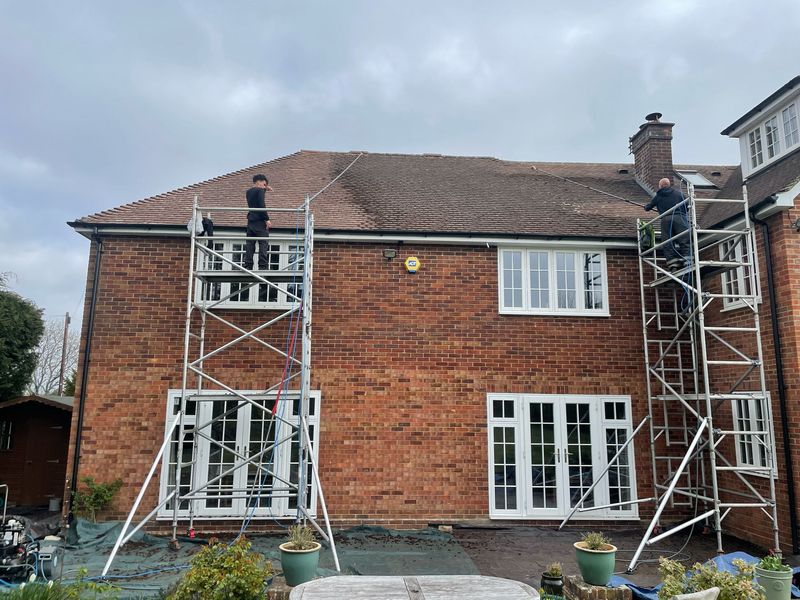 Roof cleaning carried out safely from scaffold towers by The Roof Moss Cleaners in Histon